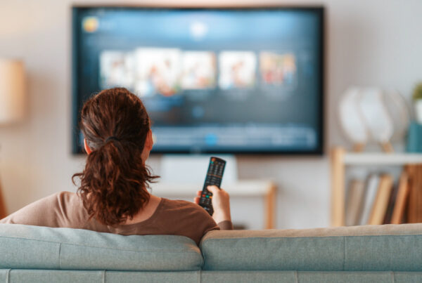 Woman relaxing on her living room floor during a sedentary day