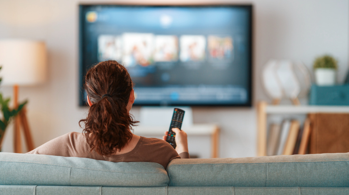 Woman relaxing on her living room floor during a sedentary day