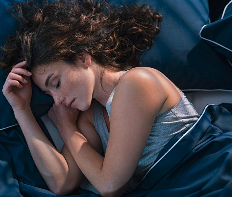 Woman sleeping peacefully in bed
