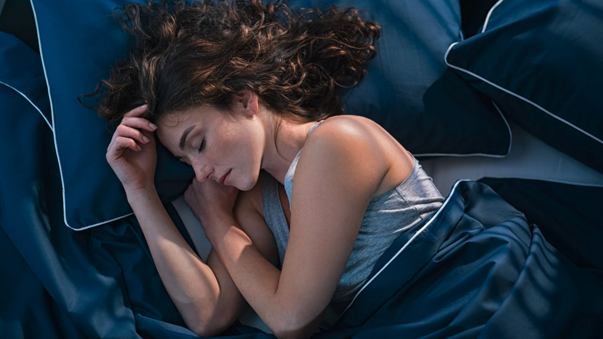 Woman sleeping peacefully in bed