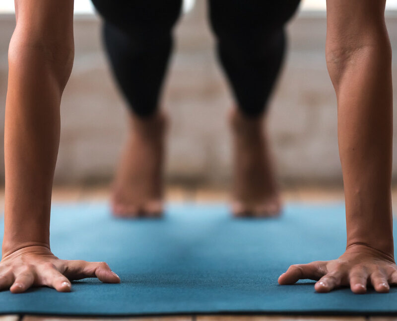 Woman doing push-ups on an exercise mat