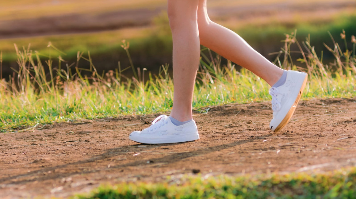 Close-up of a woman's legs walking outdoors
