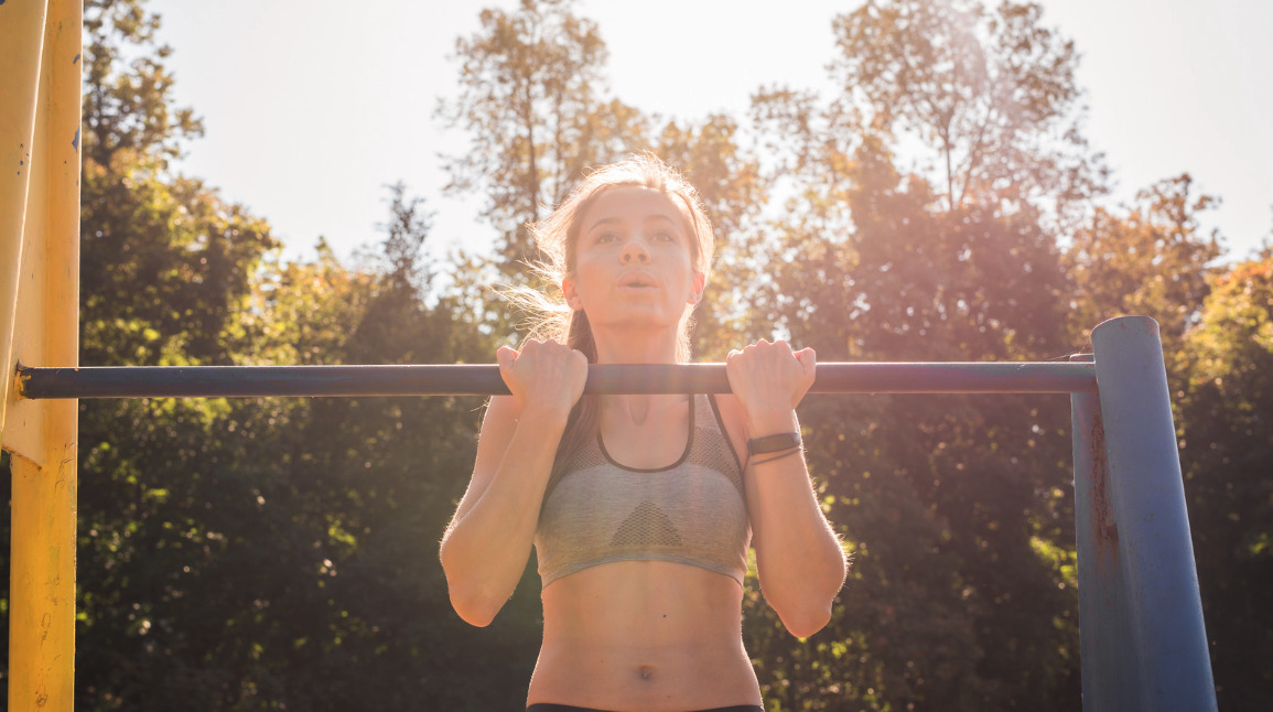 Woman stretching outdoors at sunset