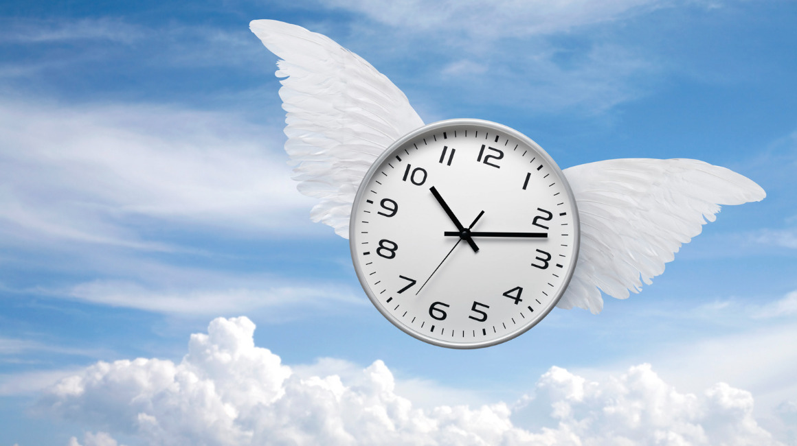 A winged clock symbolizing time flying by