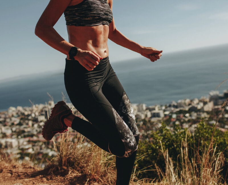 Woman running outdoors during a workout