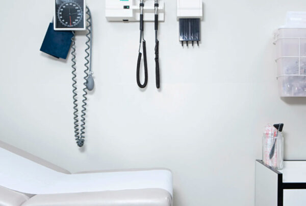 A scale and blood pressure cuff in a doctor's office