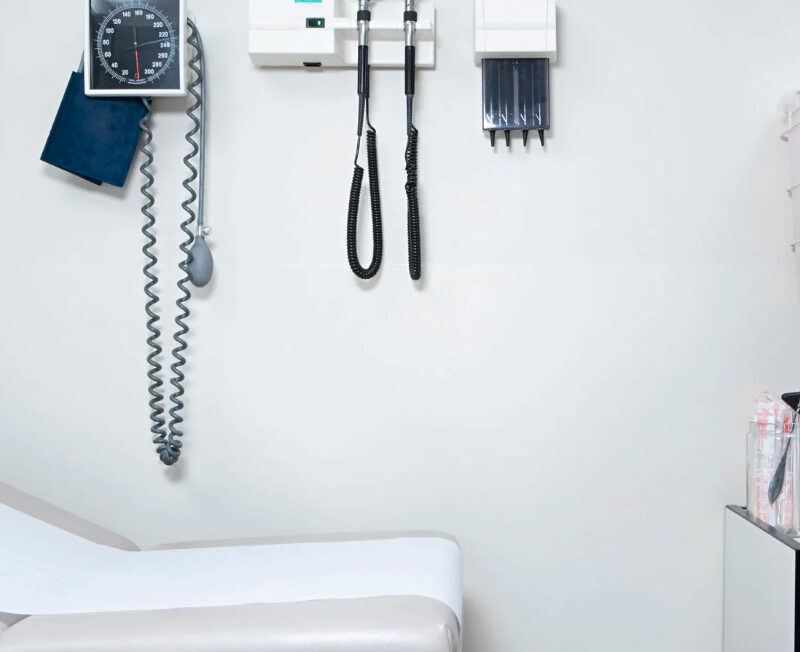A scale and blood pressure cuff in a doctor's office